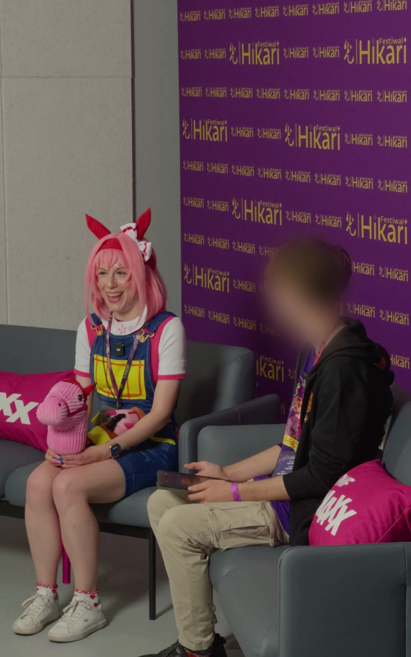 Toraishya in cosplay answering questions in an interview at Hikari Festival