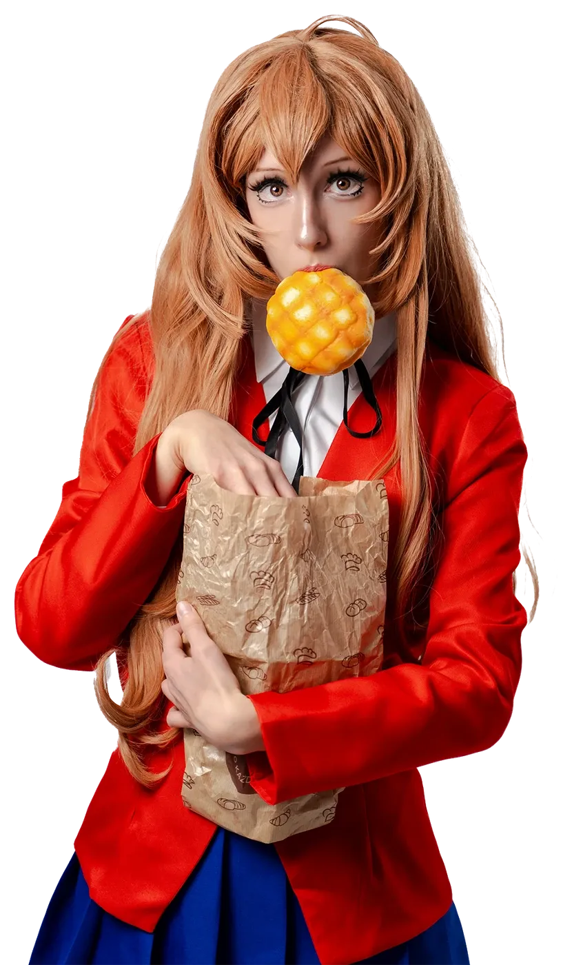 Toraishya in her Taiga cosplay from Toradora, holding a paper bag of bread with a melon bread in her mouth